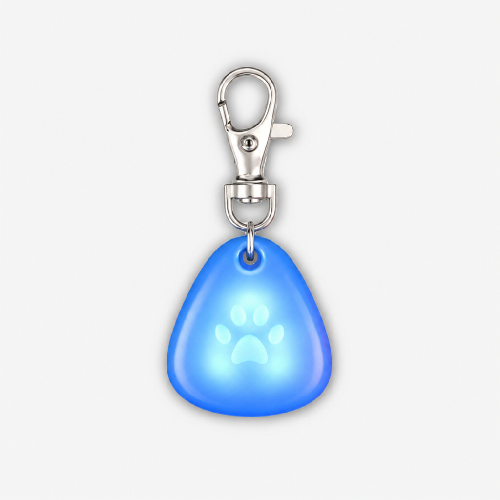 Blue glowing Yogi-Pets dog tag with a silver clip on a white background