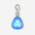 Blue glowing Yogi-Pets dog tag with a silver clip on a white background