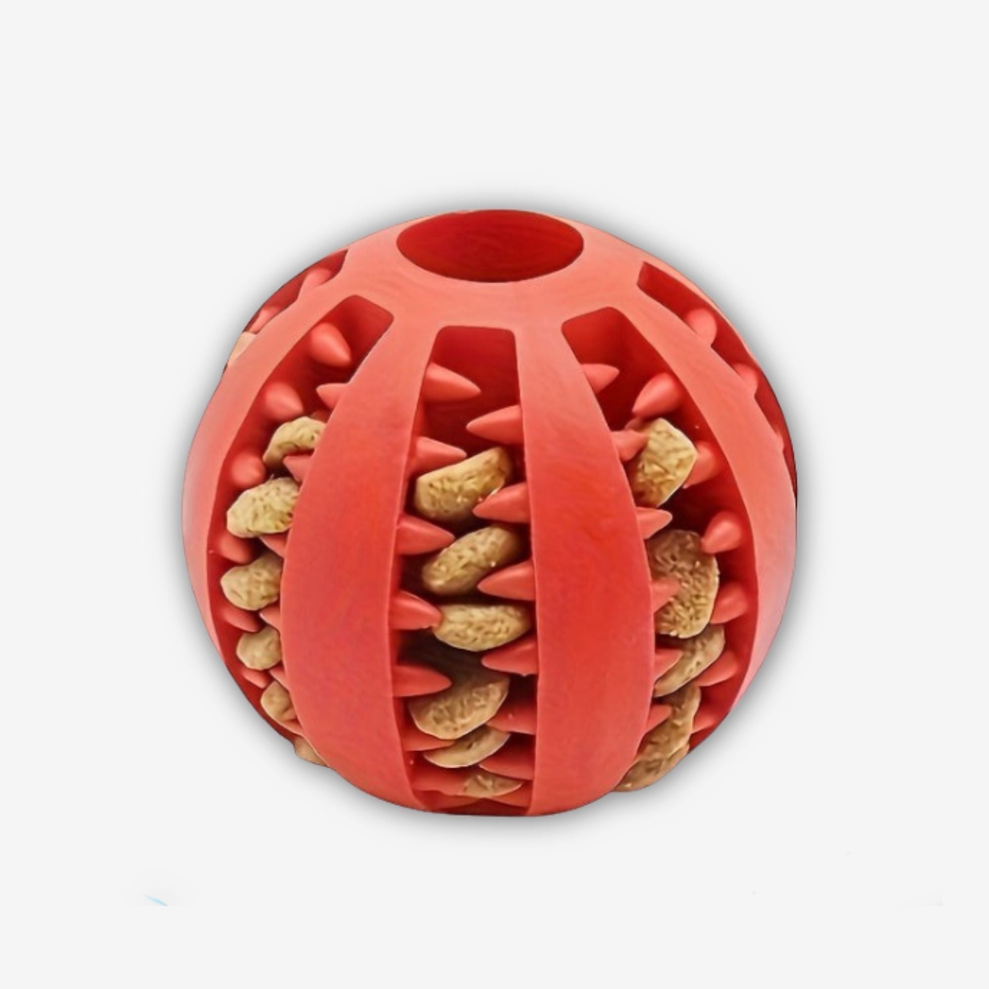 Yogi Pets Red dog toy ball with textured surface and small holes filled with dog treats on a white background