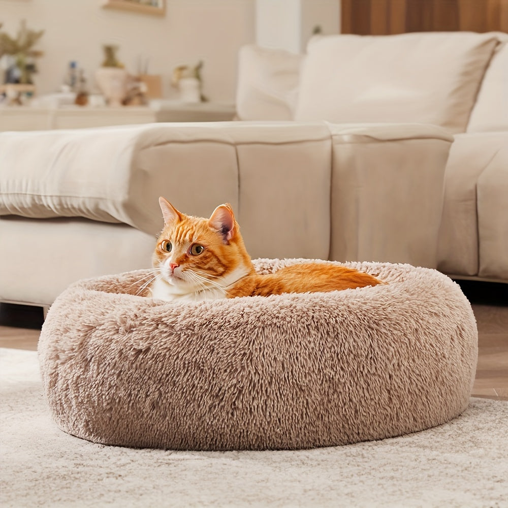 Cozy cat napping in a Yogi-Pets self-warming calming donut bed - Beige
