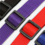 Close-up of the durable adjustable buckles on Yogi-Pets car safety belts in multiple colours
