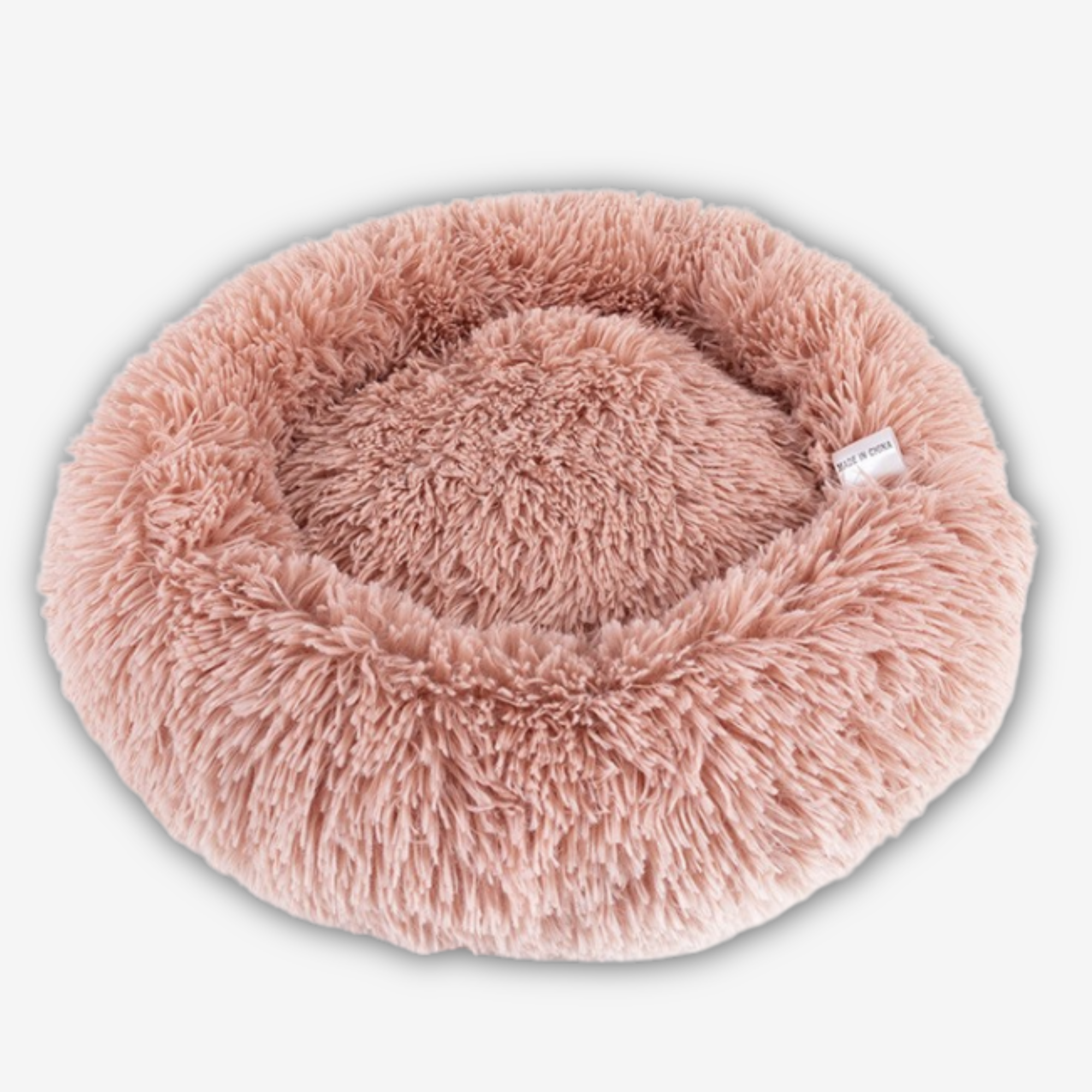 Yogi-Pets Fluffy pink pet bed on a light gray background